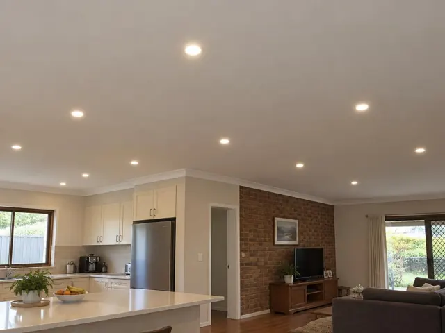 Recessed LED downlights in an open-plan kitchen and living room with brick feature wall in Mount Colah
